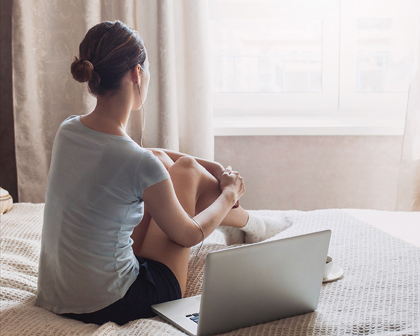 Woman with a laptop looking for depression counseling in Columbia, MD