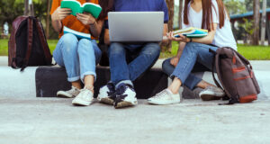 Image of 3 friends sitting together working on homework. Representing things that are important to your teen and that therapy for teengars in Baltimore or the Washington D.C. area can help with. A therapist for teens in Columbia, MD can help support communication with them.