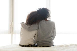 Image of a mom and daughter hugging each other. Showing a benefit that can come from counseling for teens in the Washington D.C. area. With support from a therapist for teens in Columbia or Baltimore, MD you can open communication with your teen.